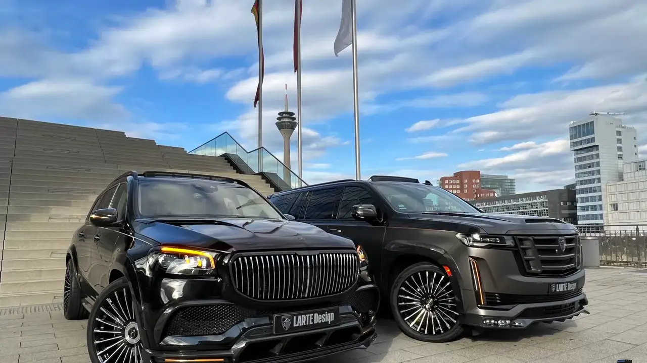 Two mint chocolate milkshakes with whipped cream and green sprinkles.